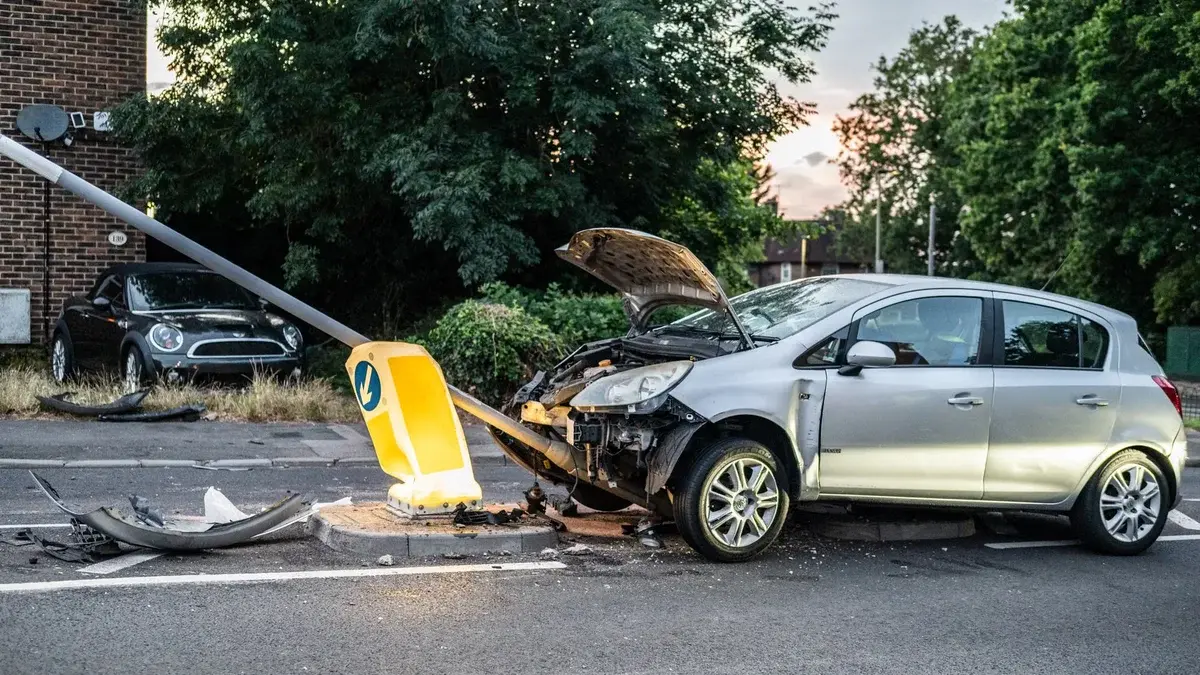 Car crashed into streetlight pole at dusk