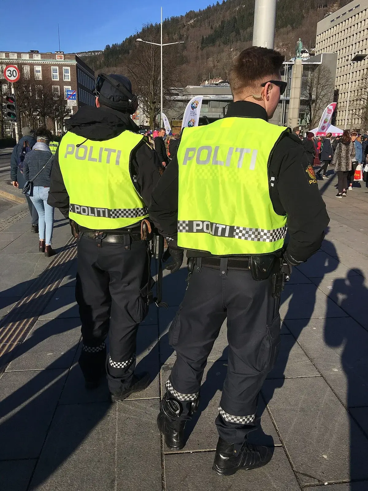 Norwegian police officers in yellow vests on city street