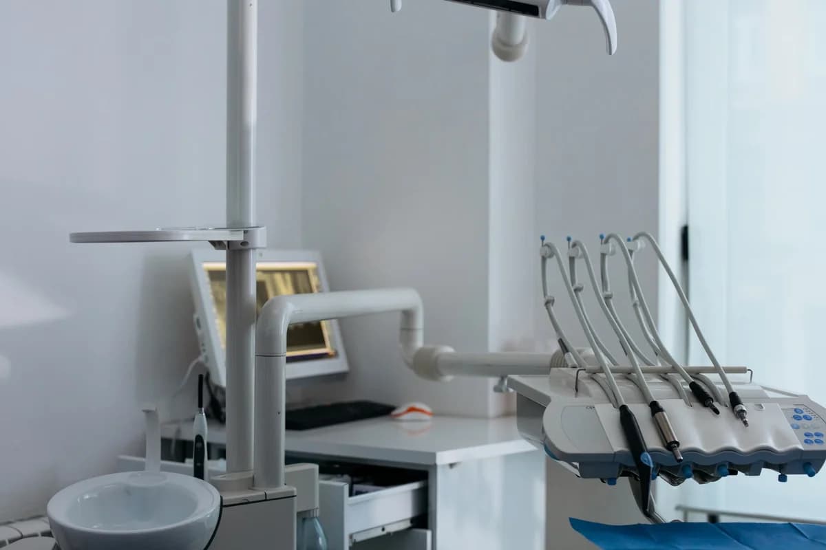 Modern dental chair with dental instruments in a clinic.